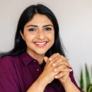 Portrait,Of,Young,Adult,Indian,Woman,Smiling,At,Camera,Relaxing